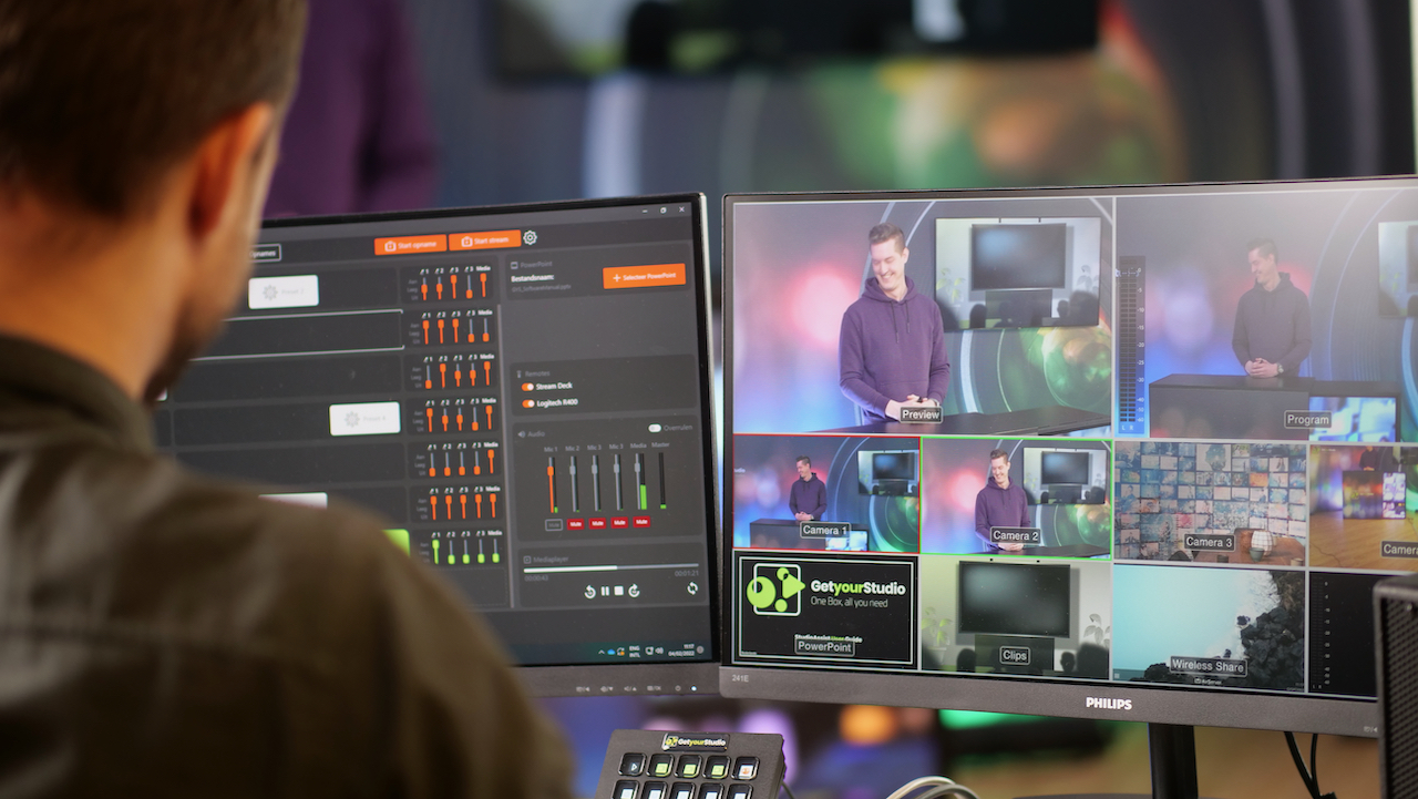 GetyourStudio StudioAssist production software interface on monitor with person